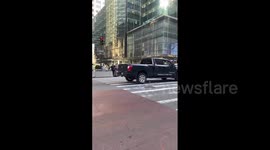 US: Man Wearing Trump Mask Directs Traffic Outside Trump Tower Ahead Of Court Hearing