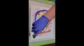 Watch this incredibly talented artist create a self-portrait over an acrylic pour
