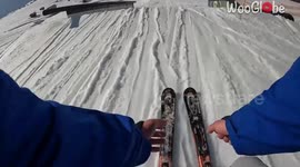 Skier chuckles at himself after a wacky stunt idea ends in an embarrassing fashion