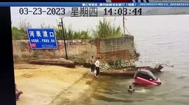 Electric car plummets off wharf, knocking man into river in China