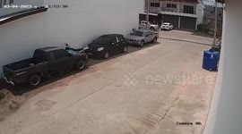Strong winds blow away clothes rack into road