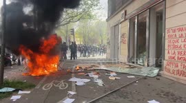 Protesters smash their way into a Paris bank during pension protest on Thursday