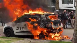 Protesters set car on fire during protests in Paris over president Macron’s pension reform bill