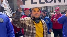 Anti-Trump person at The Pro-Trump side of The Protest in New York, USA