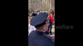 Anti-Trump Person Surrounded by Trump Supporters at The Protest in New York, USA