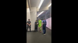 Police officers line up to shake hands with Messi during halftime of Argentina game