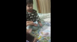 A fight between two siblings for colour book... Both want to do colouring