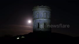 Full pink moon rising over Solomon's Temple, Buxton, Derbyshire - 4K Editorial