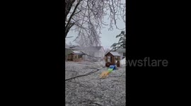 Canada: Camera Captures Tree Branch Snapping And Falling On Yard During Ice Storm