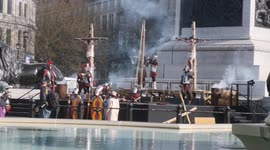 Jesus goes up on the cross in a performance of The Passion Of Jesus in Trafalgar Square