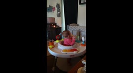 Baby girl eating ice cream