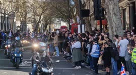 Huge crowds watch on as motorcyclists ride in tribute to late Queen in central London