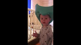 Hilarious toddler wears toilet seat on head like cowboy hat