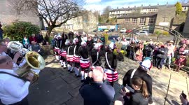 Controversial Morris dancers who black up their faces perform in English village