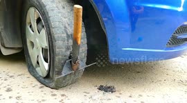 Here's what happens when a car drives over a RED-HOT AXE
