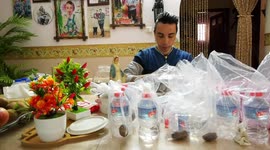 A Palestinian christian Ehab Ayyad, 29, distributes dates and water for Muslims, just before breaking their fast during the holy fasting month of Ramadan