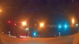 Close Call: Red Light Runner Speeding Passes Driver On Quiet Road