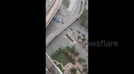 Floodwater pours into construction site as thunderstorm inundates Miami