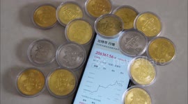 Physical bitcoins are displayed by netizens in Yichang, China