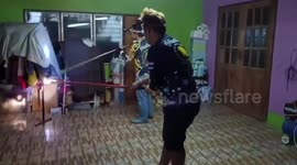 Brave volunteers tackle aggressive 13ft king cobra coiled on clothesline
