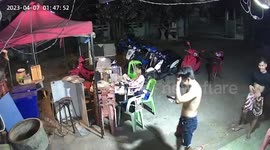 Terrified men hunt for giant centipede rampaging through food stall