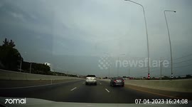 Stray hammer flies from truck and hits car travelling behind