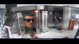 Motorist crashes car into glasses store in eastern India with narrow escape for employee