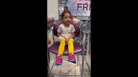 Little girls is excited to get her ears pierced *wholesome laughter*