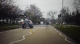 Van uses wrong lane at roundabout. Near miss. UK roads left lane for ahead and left.turns right. miss