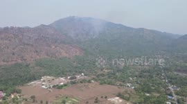 Drone footage shows reignited mountain fire raging in central Thailand