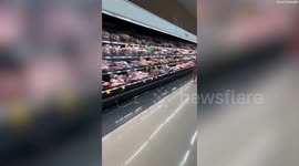 Huge possum spotted walking across meat section at Australian supermarket