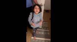 Loving parents surprise their daughter with an early birthday present