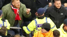 Bayern Munchen Ultras clash with police and Manchester City fans after Champions League tie at the Etihad
