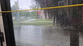School kids forced to wade through ankle-deep floodwater as storm hits Florida