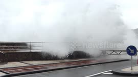 Woman drenched by wave that crashed over sea wall in San Sebastian as Storm Noa strikes Spain