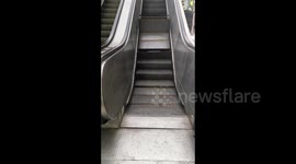 Outdoor escalator buckles and folds during operation in southern China