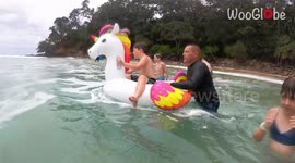 Boy experiences EPIC surfing WIPEOUT despite having the lucky charm of a unicorn