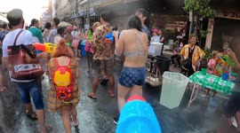 Join the action with this water gun POV video at the Songkran Buddhist festival