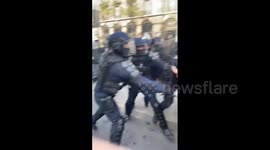 Police use batons to remove protesters in Paris, France