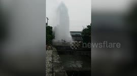 Water pipe explodes creating fountain on road