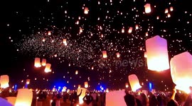 Thousands gather to release stunning sky lanterns to celebrate Dai New Year in southwestern China