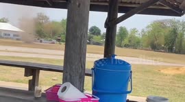 Dust devil whirls across street in Thailand