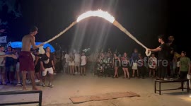 Jumping in flaming skipping rope is a thing on this Thai island