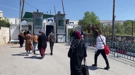 Palestinians cross an Israeli checkpoint in Bethlehem to attend the fourth Friday Noon prayers during the Muslim holy fasting month of Ramadan at al-Aqsa mosque compound in Jerusalem