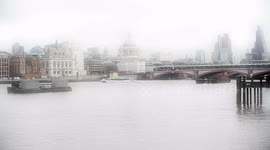 Artist Carving Shapes With A Shovel In The Sand Over Foggy Weather On The River Thames South Bank
