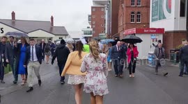 Glamourous racegoers have braved the rain to flock to Aintree racecourse for the Grand National Festival's Ladies Day