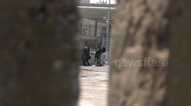 Palestinian worshippers pass the Qalandia checkpoint into Jerusalem to attend the fourth Friday prayer of the holy month of Ramadan at Al-Aqsa Mosque in Jerusalem's old city