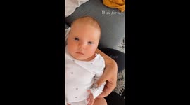 Cute 1 month old baby girl first smiles