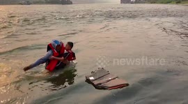 Heroic captain jumps into river to save drowning boy in China