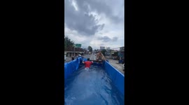Indonesian Muslims convert truck into mobile pool to carry out Islamic tradition